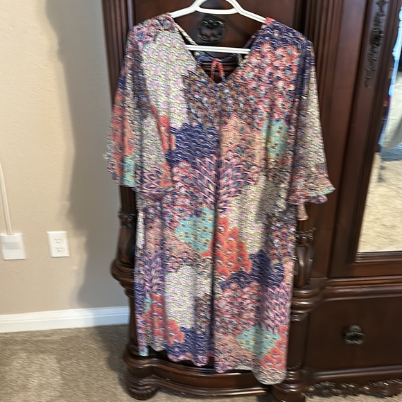 This is a soft boho midi dress with flutter sleeves.  Back has straps. - Picture 5 of 6
